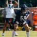 Jul 23, 2025; Lake Forest, IL, USA; Chicago Bears offensive tackle Darnell Wright (58) stretches during training camp at Halas Hall.