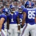 Sep 14, 2025; Arlington, Texas, USA; New York Giants wide receiver Malik Nabers (1) celebrates with teammates after scoring a touchdown against the Dallas Cowboys during the second quarter at AT&T Stadium.