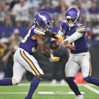 Sep 14, 2025; Minneapolis, Minnesota, USA; Minnesota Vikings quarterback J.J. McCarthy (9) hands off the ball to Minnesota Vikings running back Aaron Jones Sr. (33) during the first half at U.S. Bank Stadium.