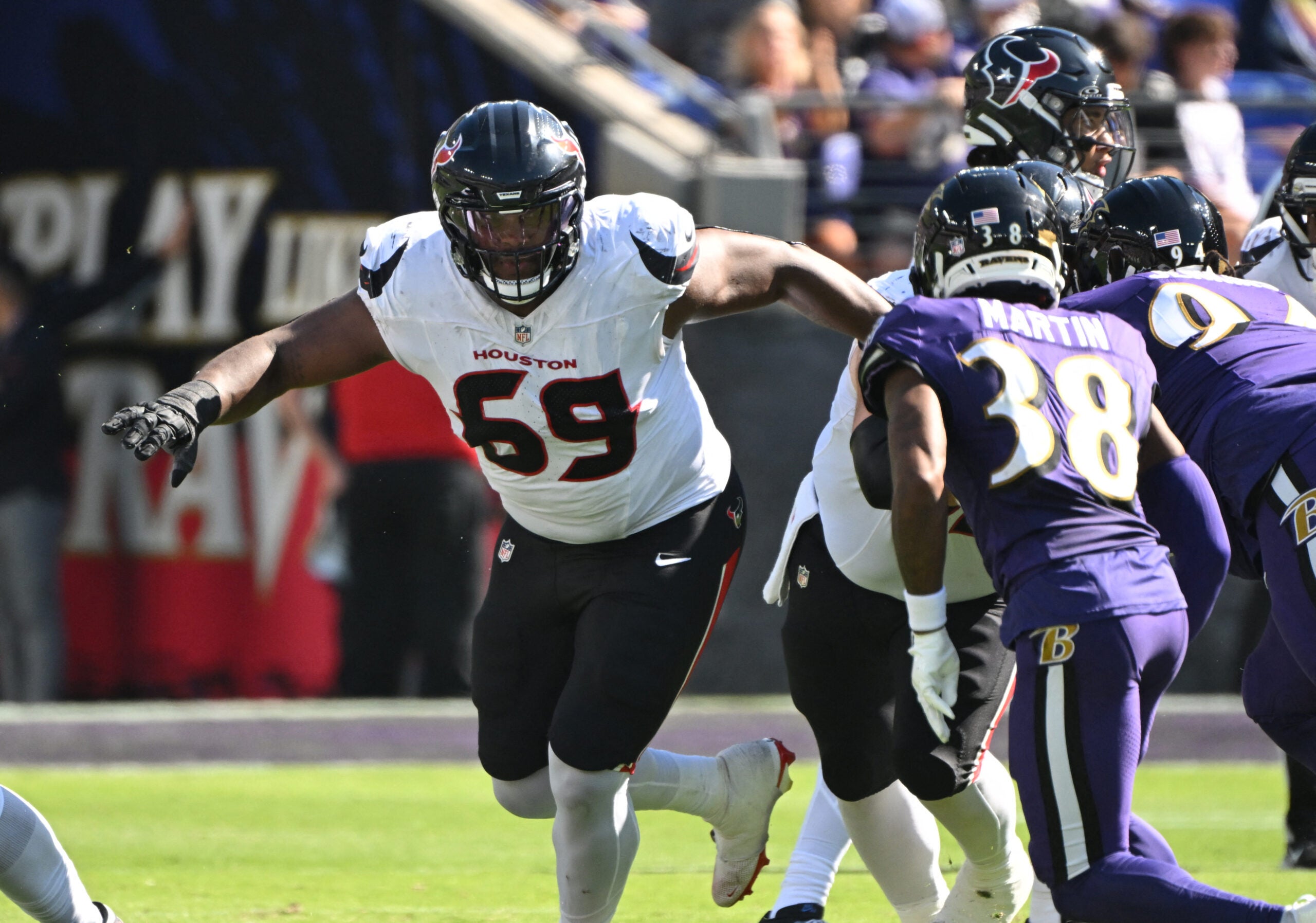 Oct 5, 2025; Baltimore, Maryland, USA; Houston Texans guard Ed Ingram (69) during play against Baltimore Ravens cornerback Keyon Martin (38) during the second quarter at M&T Bank Stadium.
