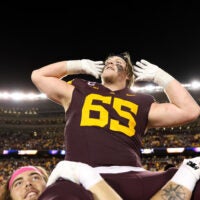 Oct 17, 2025; Minneapolis, Minnesota, USA; Minnesota Golden Gophers offensive lineman Greg Johnson (65) celebrates after the teams win against the Nebraska Cornhuskers at Huntington Bank Stadium.