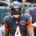 Oct 19, 2025; Chicago, Illinois, USA; Chicago Bears running back D'Andre Swift (4) reacts after rushing for a touchdown against the New Orleans Saints during the second quarter at Soldier Field.