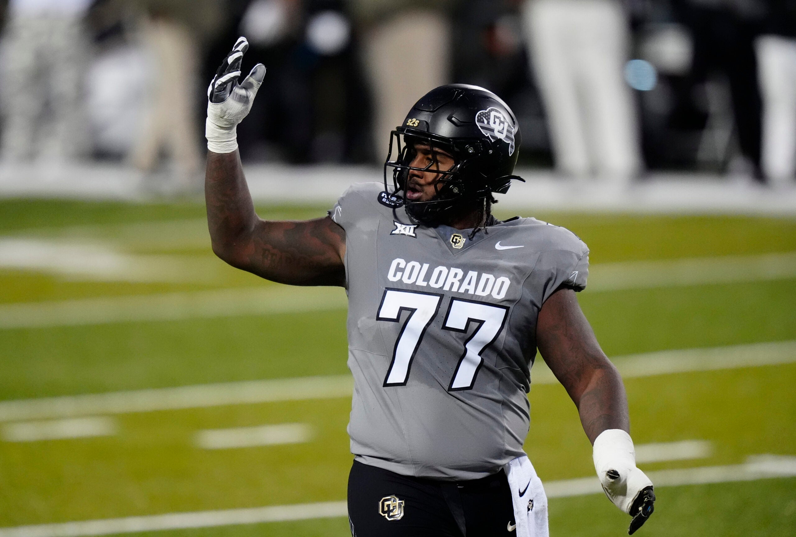 Nov 1, 2025; Boulder, Colorado, USA; Colorado Buffaloes offensive lineman Jordan Seaton (77) reacts to a penalty called during the second quarter against the Arizona Wildcats at Folsom Field.