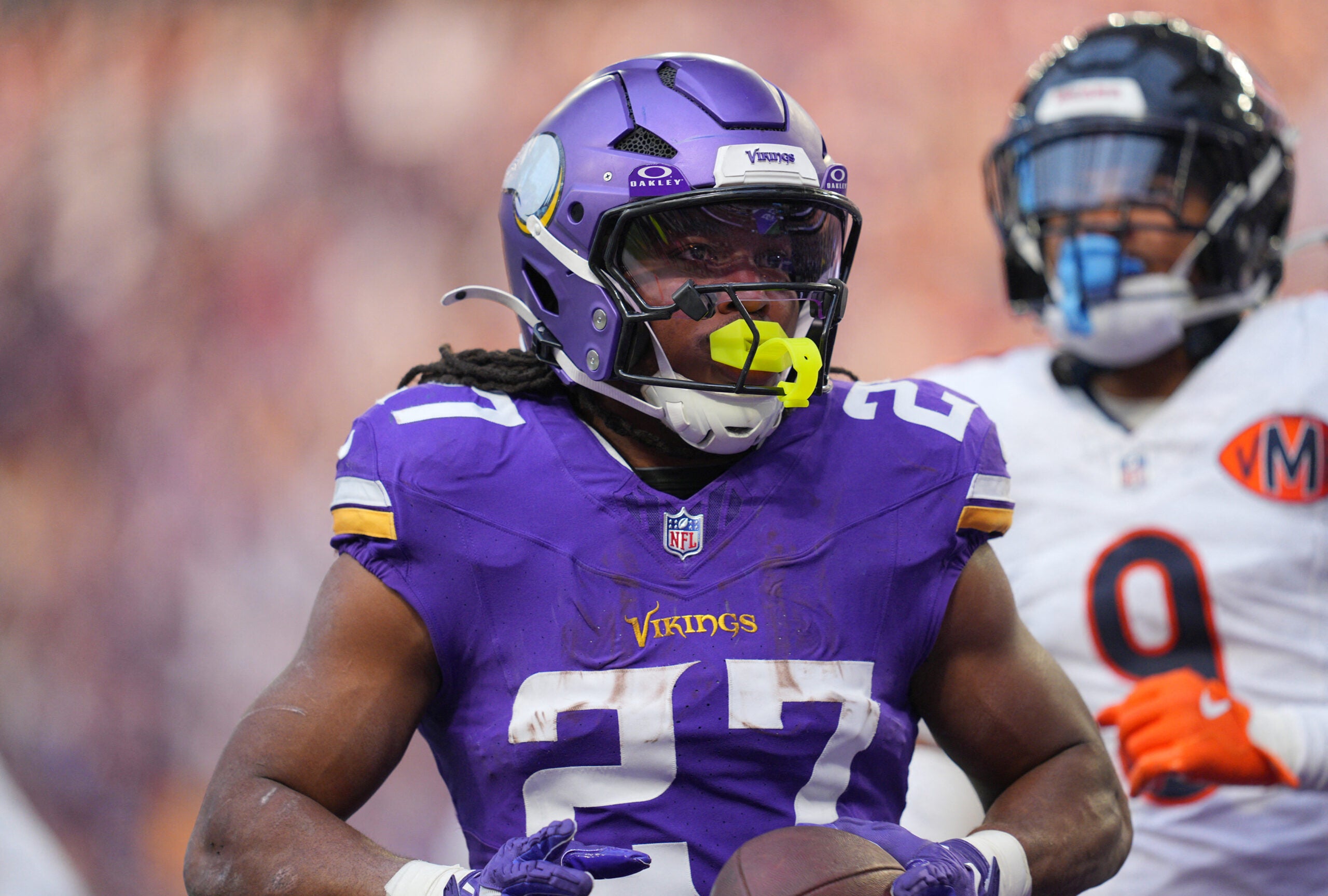Nov 16, 2025; Minneapolis, Minnesota, USA; Minnesota Vikings running back Jordan Mason (27) runs in for a touchdown during the fourth quarter against the Chicago Bears at U.S. Bank Stadium.