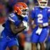 Nov 29, 2025; Gainesville, Florida, USA; Florida Gators running back Jadan Baugh (13) rushes with the ball against the Florida State Seminoles during the second half at Ben Hill Griffin Stadium.