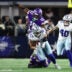 Dec 14, 2025; Arlington, Texas, USA; Minnesota Vikings linebacker Dallas Turner (15) tackles Dallas Cowboys tight end Jake Ferguson (87) during the first half at AT&T Stadium.