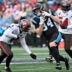 Dec 21, 2025; Charlotte, North Carolina, USA; Carolina Panthers tight end Mitchell Evans (84) runs against Tampa Bay Buccaneers linebacker Sirvocea Dennis (8) and linebacker Lavonte David (54) during the first half at Bank of America Stadium.