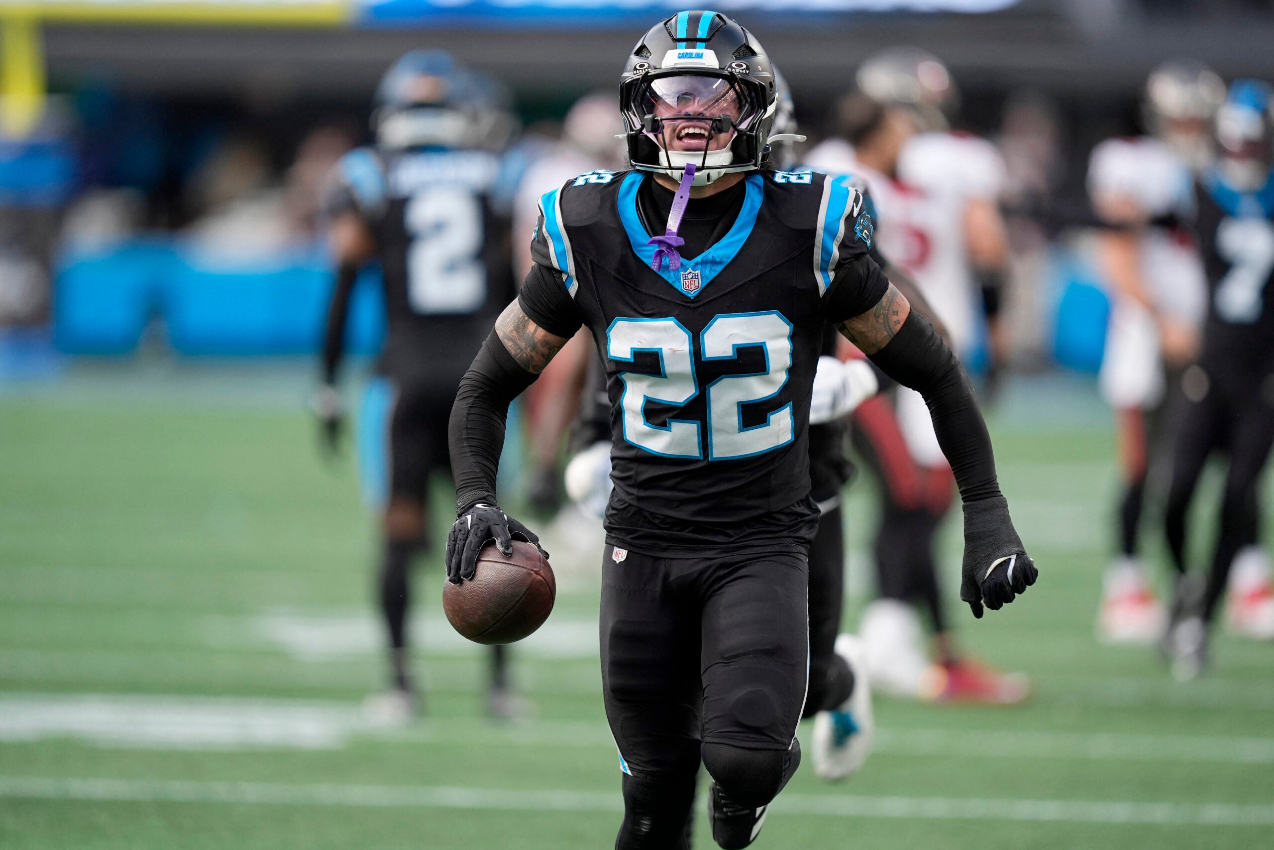 Dec 21, 2025; Charlotte, North Carolina, USA; Carolina Panthers safety Lathan Ransom (22) celebrates after an interception during the second half against the Tampa Bay Buccaneers at Bank of America Stadium.