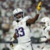 Dec 25, 2025; Minneapolis, Minnesota, USA; Minnesota Vikings running back Aaron Jones Sr. (33) celebrates after scoring a touchdown against the Detroit Lions in the first quarter at U.S. Bank Stadium.