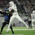 Dec 25, 2025; Minneapolis, Minnesota, USA; Minnesota Vikings wide receiver Justin Jefferson (18) makes a catch defended by Detroit Lions cornerback Amik Robertson (21) in the third quarter at U.S. Bank Stadium.