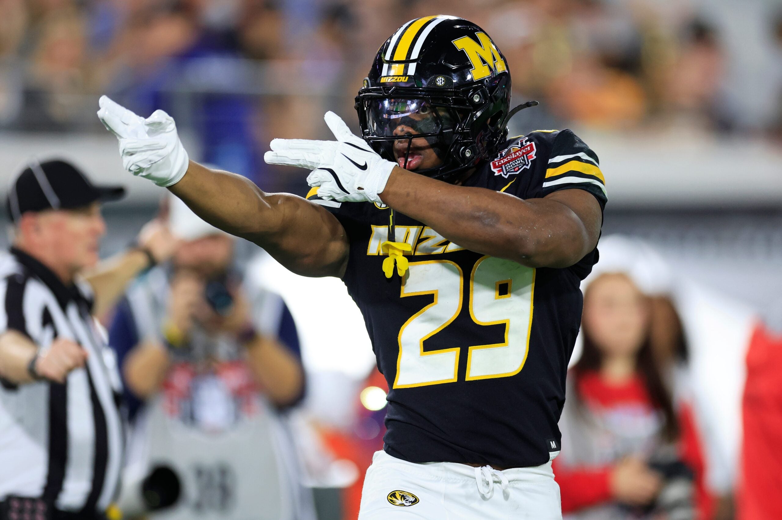 Missouri Tigers running back Ahmad Hardy (29) reacts to his first down pickup during the first quarter of the TaxSlayer Gator Bowl at EverBank Stadium, Saturday, Dec. 27, 2025, in Jacksonville. Fla.