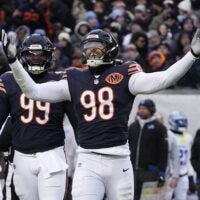 Jan 4, 2026; Chicago, Illinois, USA; Chicago Bears defensive end Montez Sweat (98) celebrates after a sack against the Detroit Lions during the first half at Soldier Field.