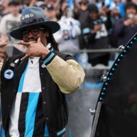 Jan 10, 2026; Charlotte, NC, USA; Former Carolina Panthers Cam Newton in the first half during the NFC Wild Card Round game at Bank of America Stadium.