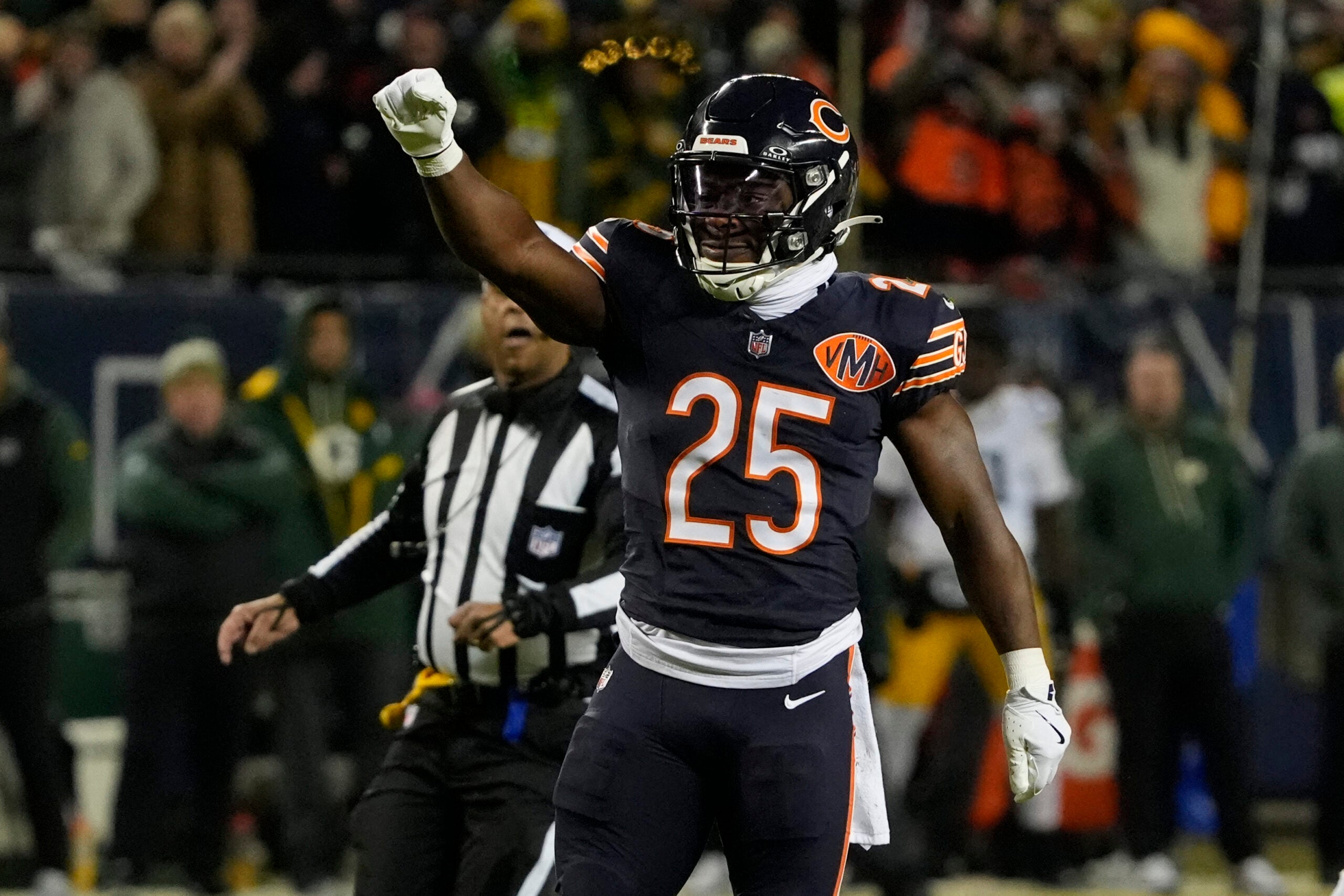 Jan 10, 2026; Chicago, IL, USA; Chicago Bears running back Kyle Monangai (25) reacts after a first down carry against the Green Bay Packers during the first half of an NFC Wild Card Round game at Soldier Field.