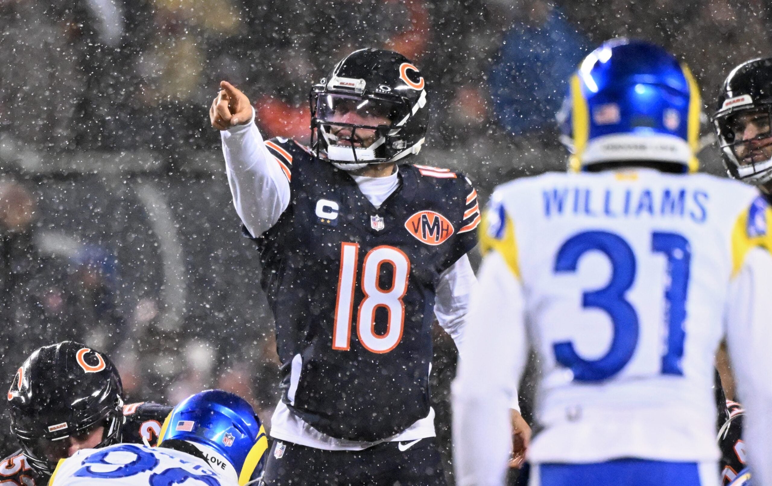 Jan 18, 2026; Chicago, IL, USA; Chicago Bears quarterback Caleb Williams (18) calls the snap count at the line of scrimmage against the Los Angeles Rams during the first quarter of an NFC Divisional Round game at Soldier Field.