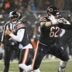 Jan 18, 2026; Chicago, IL, USA; Chicago Bears guard Joe Thuney (62) blocks for quarterback Caleb Williams (18) against Los Angeles Rams linebacker Jared Verse (8) during the first quarter of an NFC Divisional Round game at Soldier Field.