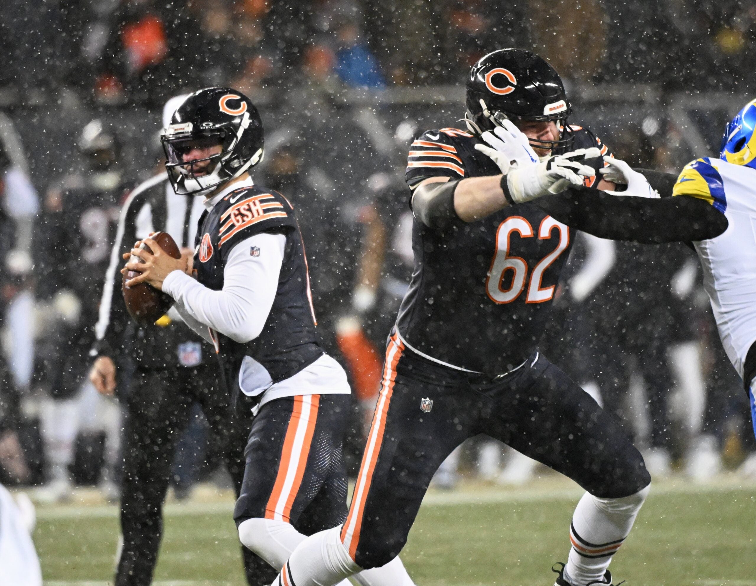 Jan 18, 2026; Chicago, IL, USA; Chicago Bears guard Joe Thuney (62) blocks for quarterback Caleb Williams (18) against Los Angeles Rams linebacker Jared Verse (8) during the first quarter of an NFC Divisional Round game at Soldier Field.