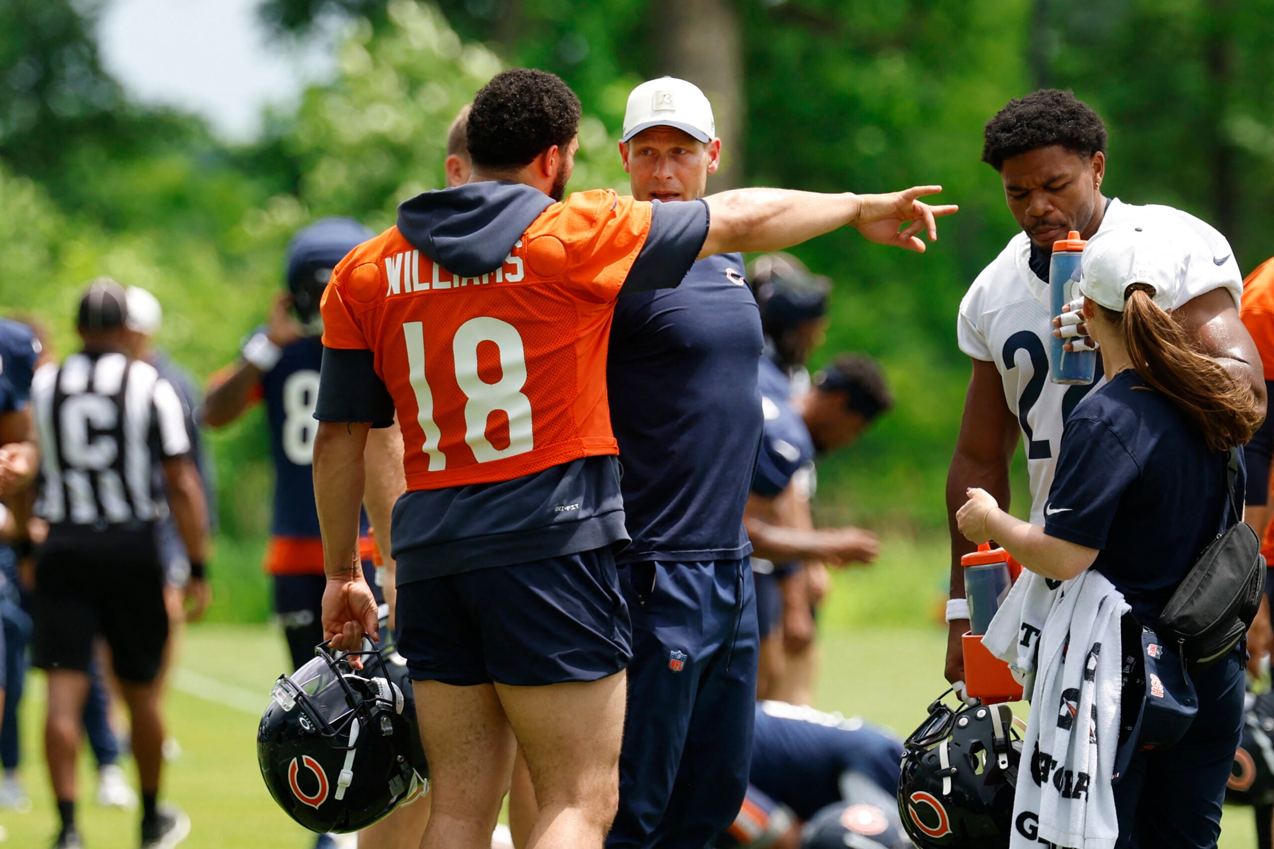 Jun 9, 2026; Lake Forest, IL, USA; Chicago Bears quarterback Caleb Williams (18) talks with head coach Ben Johnson during Minicamp at Halas Hall.