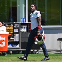 Jun 9, 2026; Foxborough, MA, USA; New England Patriots wide receiver A.J. Brown (1) arrives on the practice field for minicamp at Gillette Stadium.