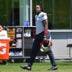 Jun 9, 2026; Foxborough, MA, USA; New England Patriots wide receiver A.J. Brown (1) arrives on the practice field for minicamp at Gillette Stadium.