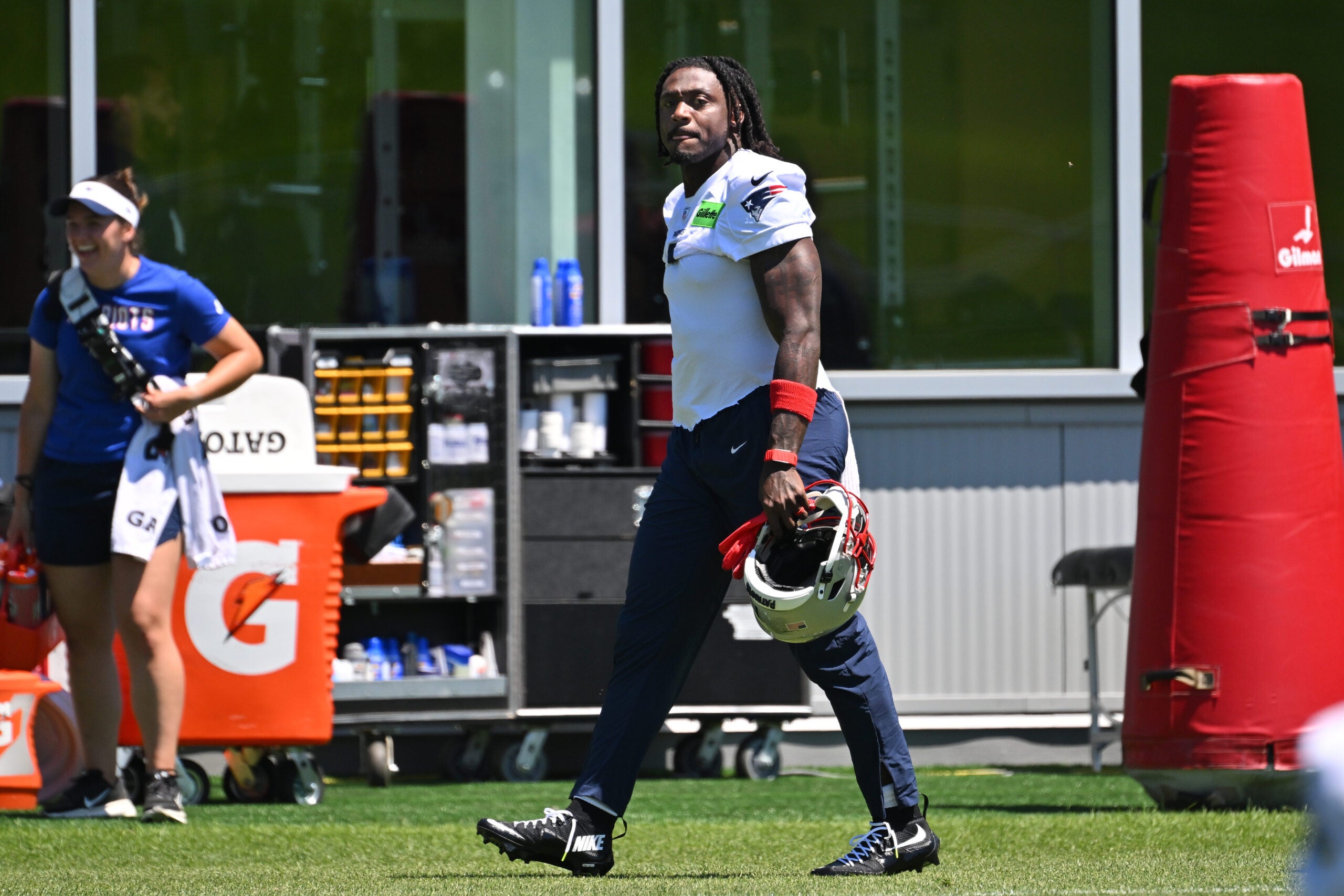 Jun 9, 2026; Foxborough, MA, USA; New England Patriots wide receiver A.J. Brown (1) arrives on the practice field for minicamp at Gillette Stadium.