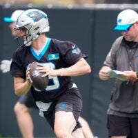 Jun 9, 2026; Charlotte, NC, USA; Carolina Panthers quarterback Haynes King (16) rolls out to pass during the first day of mini camp at Bank of America Stadium practice facility.