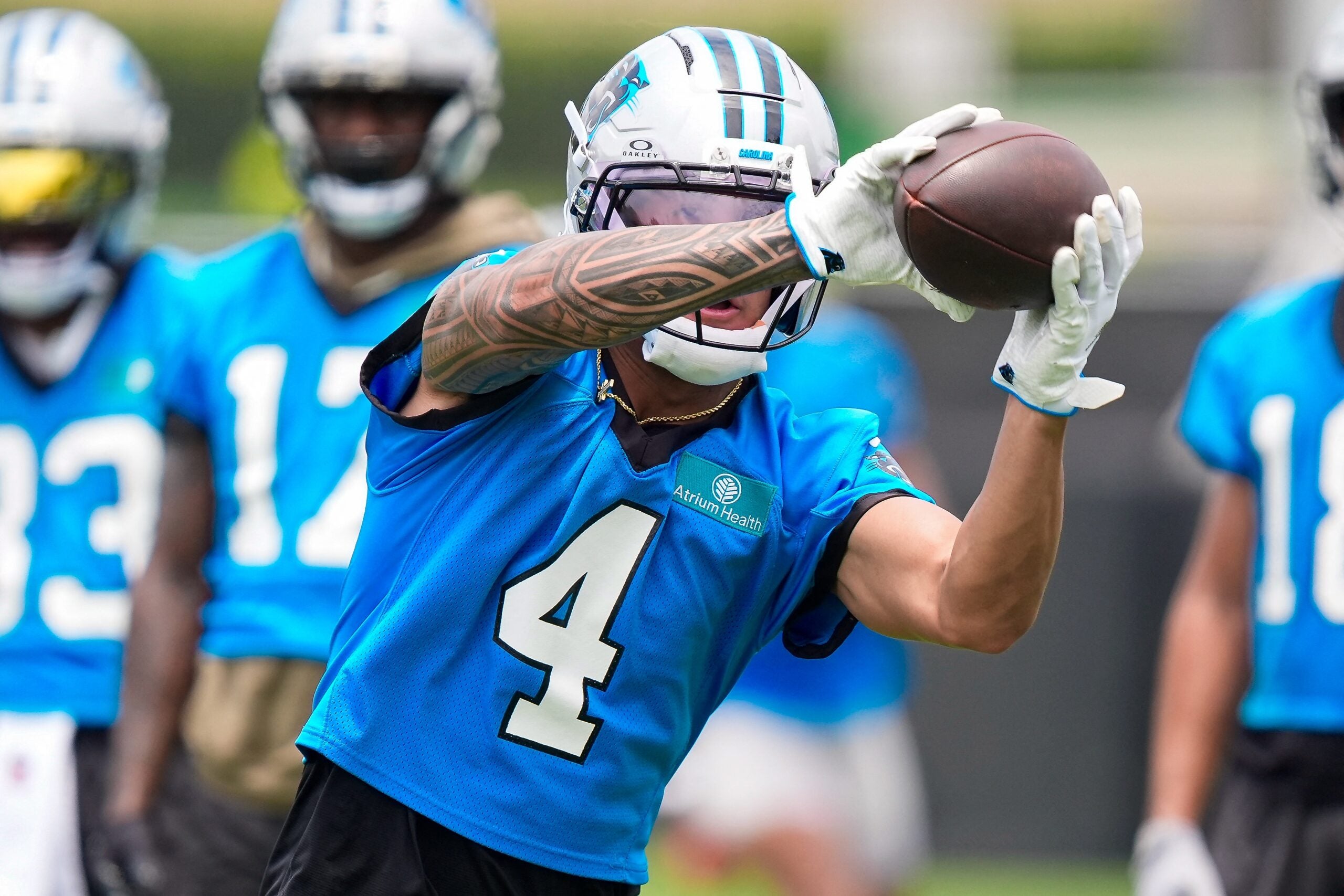 Jun 9, 2026; Charlotte, NC, USA; Carolina Panthers wide receiver Tetairoa McMillan (4) makes the catch during the first day of mini camp at Bank of America Stadium practice facility.