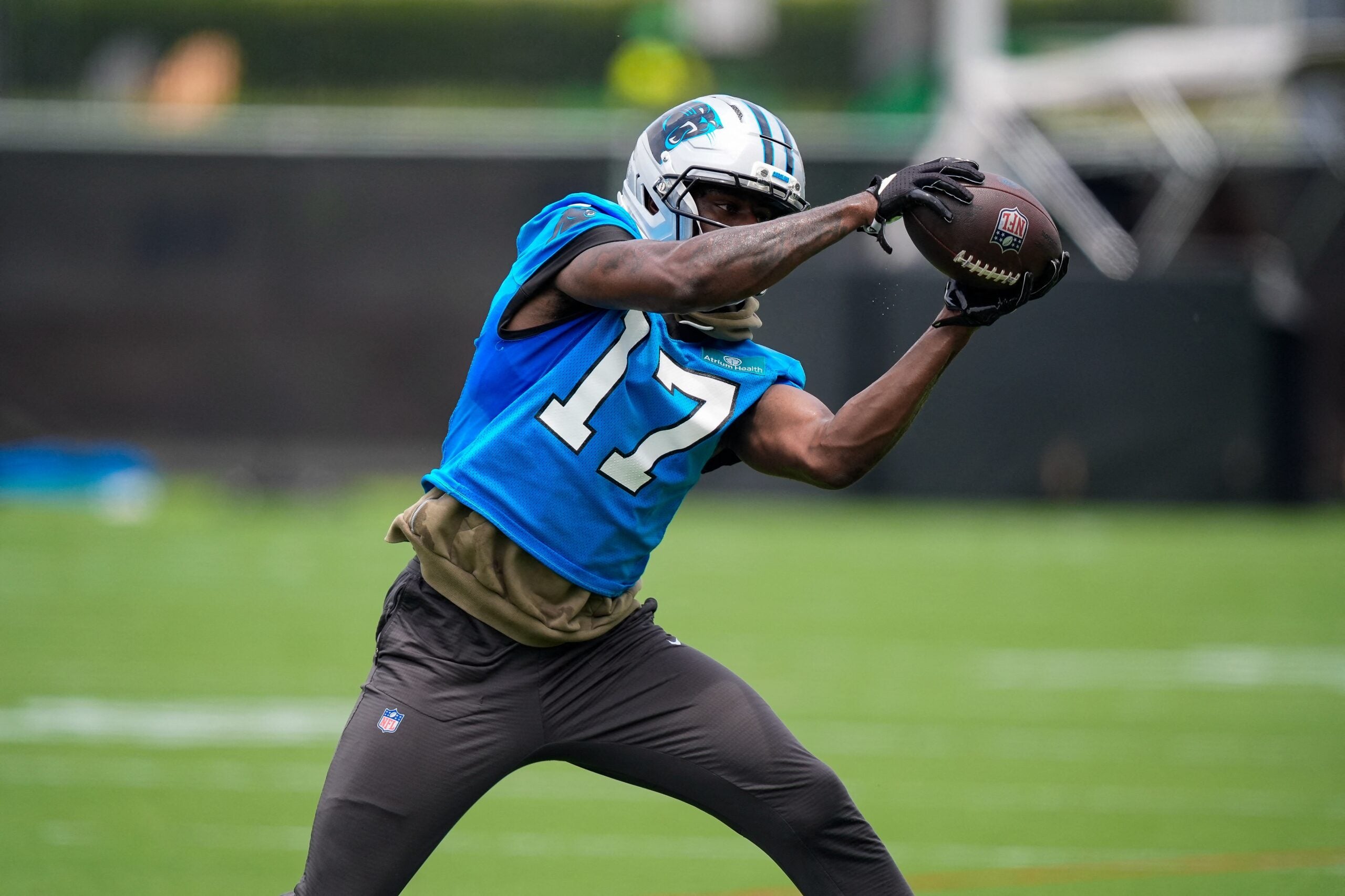 Jun 9, 2026; Charlotte, NC, USA; Carolina Panthers wide receiver Xavier Legette (17) reaches for the catch during the first day of mini camp at Bank of America Stadium practice facility.