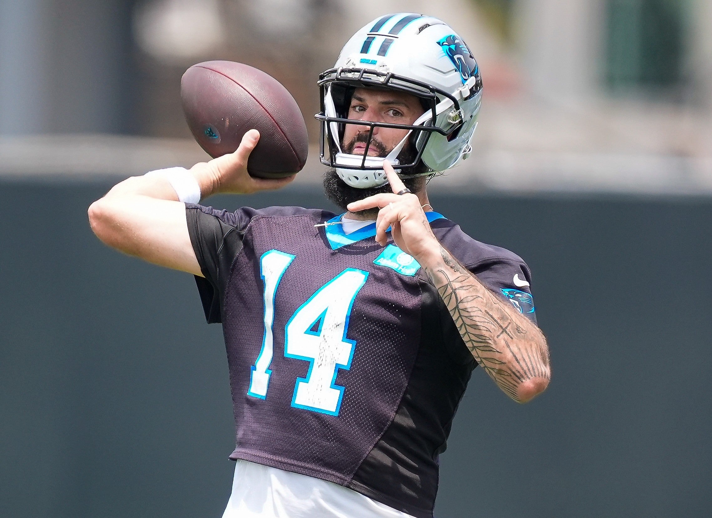 Jun 9, 2026; Charlotte, NC, USA; Carolina Panthers quarterback Will Grier (14) throws during the first day of mini camp at Bank of America Stadium practice facility.