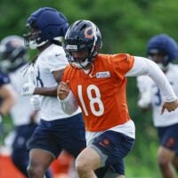 Jun 11, 2026; Lake Forest, IL, USA; Chicago Bears quarterback Caleb Williams (18) runs on the field during Minicamp at Halas Hall.