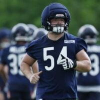 Jun 11, 2026; Lake Forest, IL, USA; Chicago Bears offensive lineman Logan Jones (54) runs on the field during Minicamp at Halas Hall.