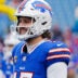 Buffalo Bills quarterback Josh Allen (17) smiles while warming up before the Buffalo Bills wild card game against the Denver Broncos at Highmark Stadium in Orchard Park on Jan. 12, 2025.