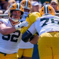 Green Bay Packers offensive linemen Jager Burton (52) and Josh Gesky (76) run through a drill during the first day of training camp on Wednesday, July 29, 2026, at the Don Hutson Center in Ashwaubenon, Wis.