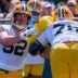 Green Bay Packers offensive linemen Jager Burton (52) and Josh Gesky (76) run through a drill during the first day of training camp on Wednesday, July 29, 2026, at the Don Hutson Center in Ashwaubenon, Wis.