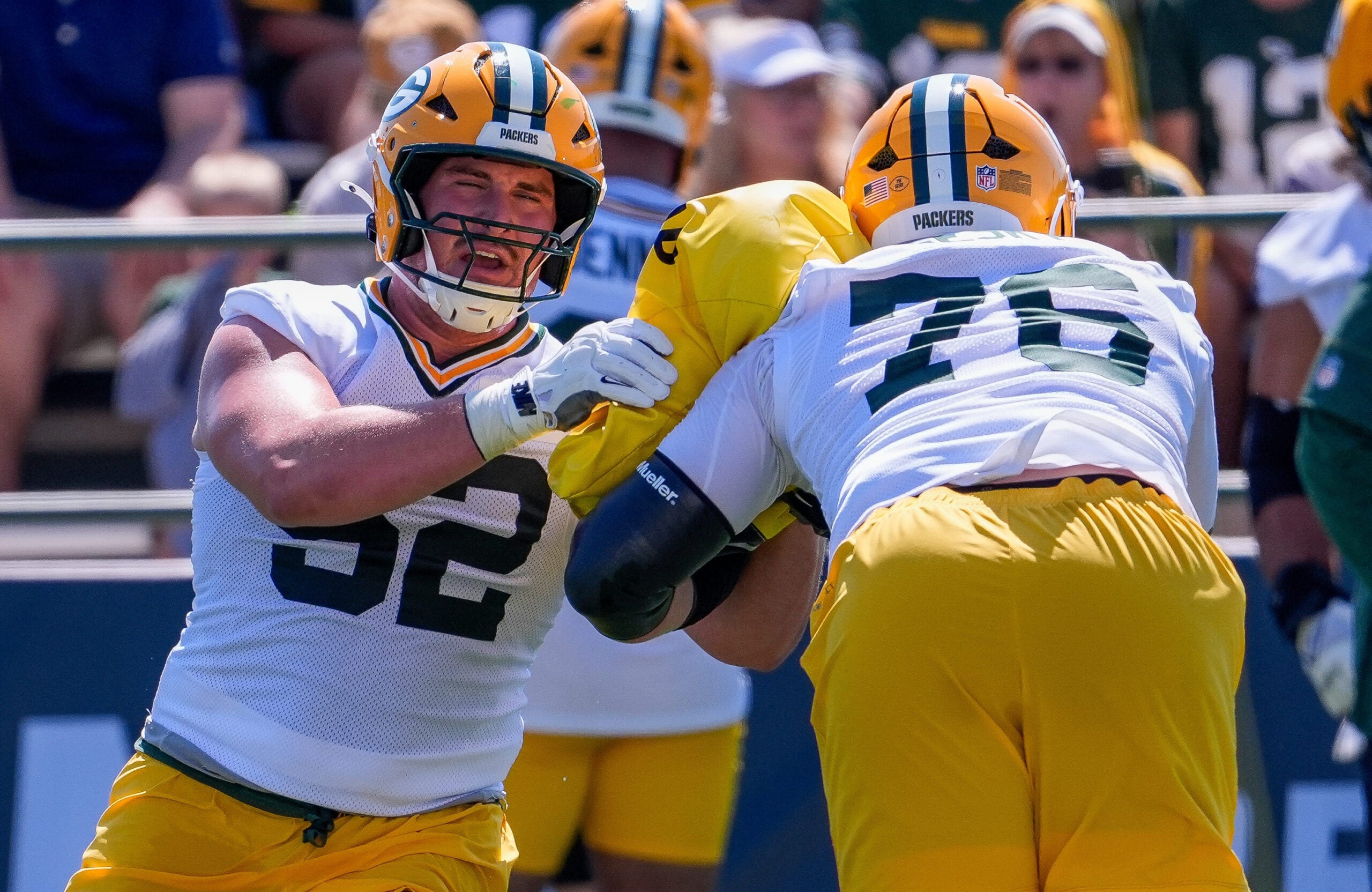 Green Bay Packers offensive linemen Jager Burton (52) and Josh Gesky (76) run through a drill during the first day of training camp on Wednesday, July 29, 2026, at the Don Hutson Center in Ashwaubenon, Wis.
