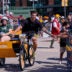 Green Bay Packers tight end Tucker Kraft rides a bicycle to practice during the first day of training camp on Wednesday, July 29, 2026, at Lambeau Field in Green Bay Wis.