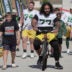 Green Bay Packers offensive tackle Jordan Morgan (77) rides a bike during the first day of training camp Wednesday, July 29, 2026 in Green Bay, Wisconsin. It is the first of three consecutive public practices. The tradition of players riding childrens bikes to practice dates back to the era when Vince Lombardi was head coach.
