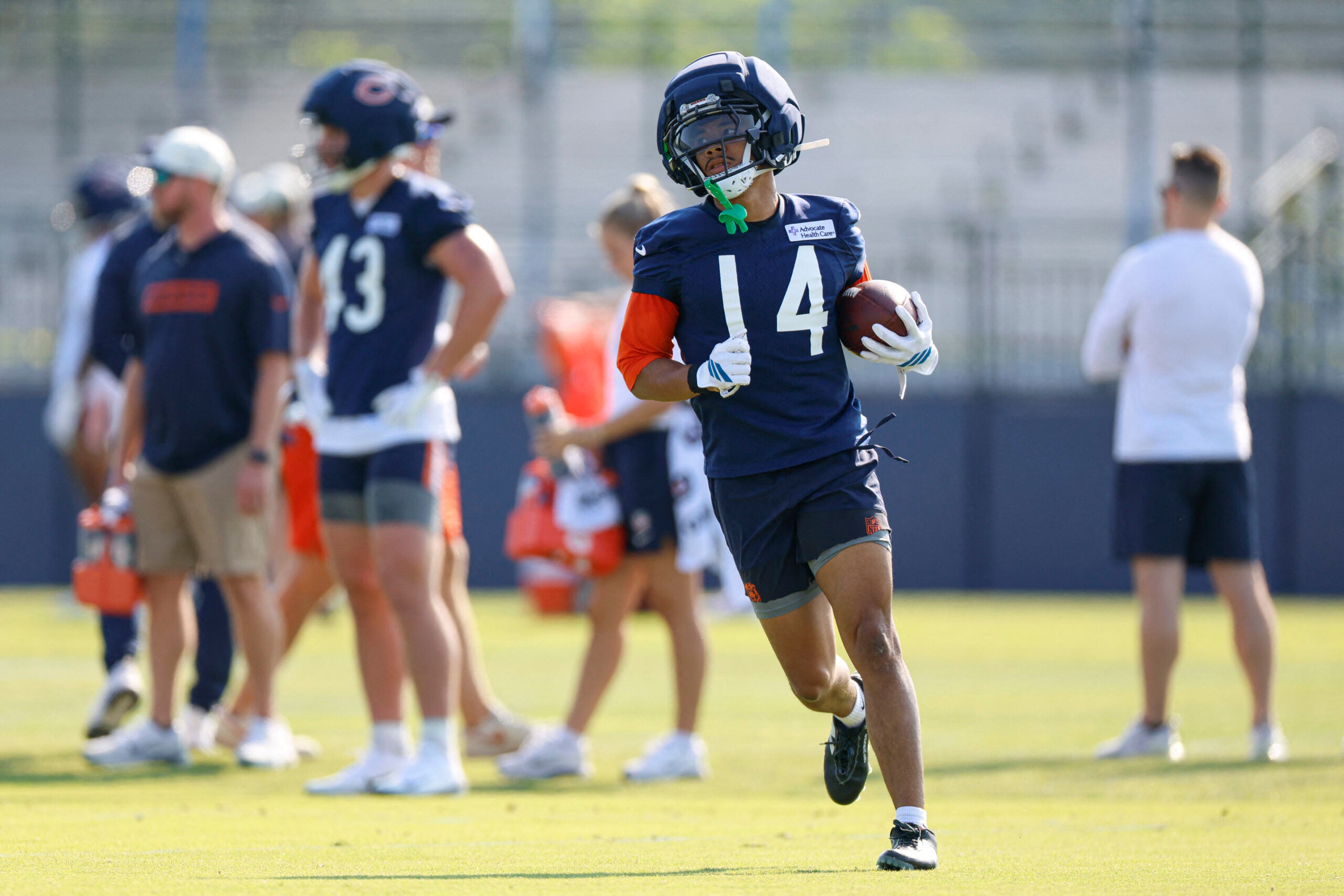 Jul 29, 2026; Lake Forest, IL, USA; Chicago Bears wide receiver Kalif Raymond (14) runs on the field during Training Camp at Halas Hall.