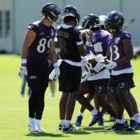 Jul 30, 2026; Owings Mills, MD, USA; Baltimore Ravens quarterback Lamar Jackson (8) calls plays during practice at Under Armour Peformance Center.
