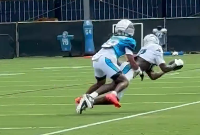 Carolina Panthers wide receiver Xavier Legette makes a catch on the sideline during training camp.