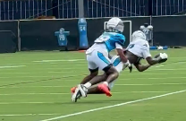 Carolina Panthers wide receiver Xavier Legette makes a catch on the sideline during training camp.