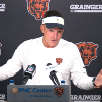 Chicago Bears defensive coordinator Dennis Allen speaks with reporters ahead of the first training camp practice.