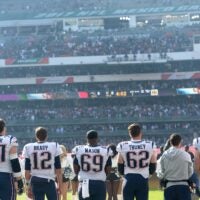 Nov 19, 2017; Mexico City, MEX; New England Patriots players look on from the sideline before the game against the Oakland Raiders at Estadio Azteca. New England won 33-8.