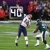 Feb 4, 2018; Minneapolis, MN, USA; New England Patriots quarterback Tom Brady (12) attempts to throw a touchdown during the final seconds of the fourth quarter as Philadelphia Eagles defensive tackle Fletcher Cox (91) defends in Super Bowl LII at U.S. Bank Stadium.