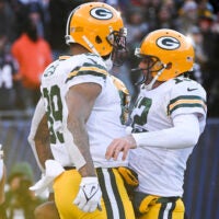 Dec 4, 2022; Chicago, Illinois, USA; Green Bay Packers tight end Marcedes Lewis (89) celebrates with quarterback Aaron Rodgers (12) after Lewis scored a touchdown against the Chicago Bears during the second half at Soldier Field.