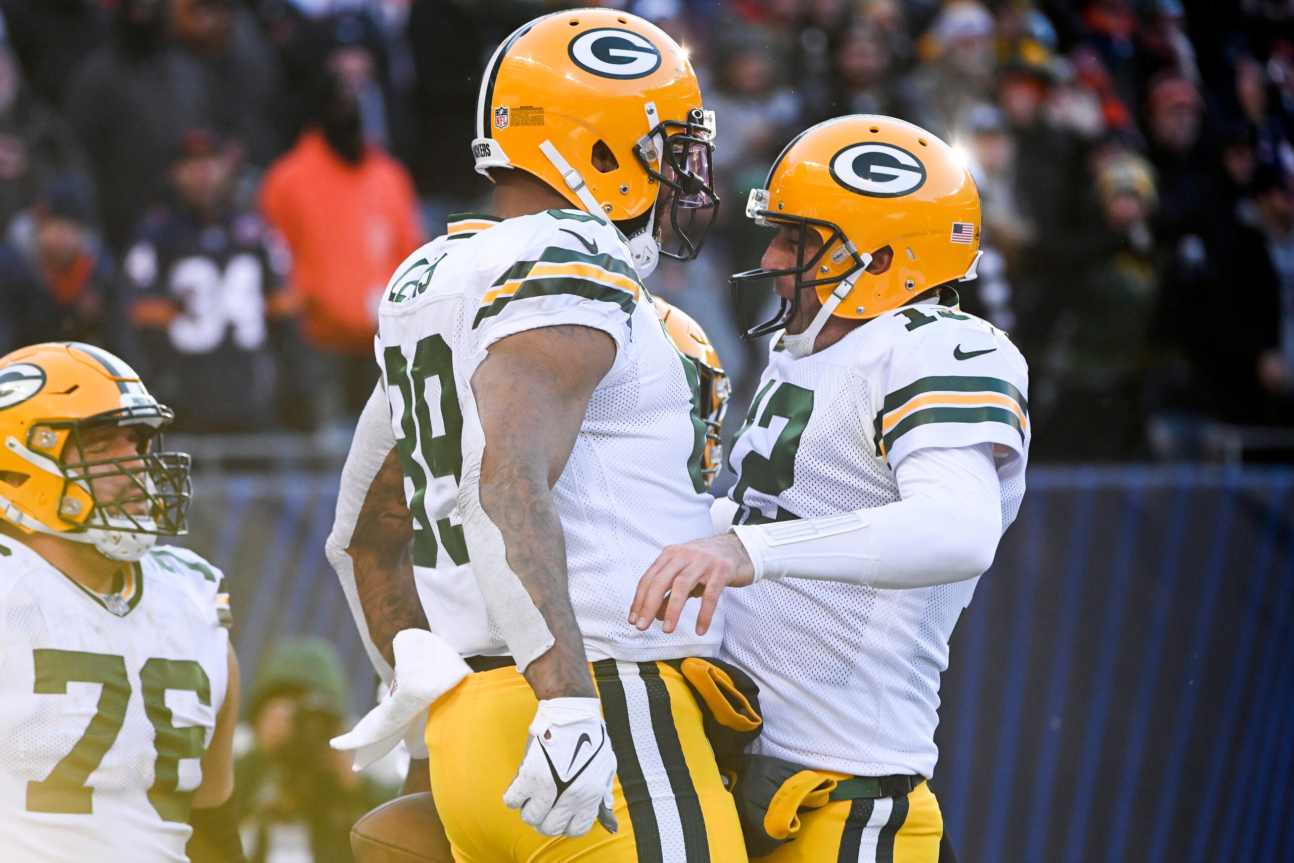 Dec 4, 2022; Chicago, Illinois, USA; Green Bay Packers tight end Marcedes Lewis (89) celebrates with quarterback Aaron Rodgers (12) after Lewis scored a touchdown against the Chicago Bears during the second half at Soldier Field.