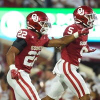 Sep 9, 2023; Norman, Oklahoma, USA; Oklahoma Sooners defensive back Peyton Bowen (22) celebrates with Oklahoma Sooners defensive back Woodi Washington (5)during the fourth quarter against the Southern Methodist Mustangs at Gaylord Family-Oklahoma Memorial Stadium.