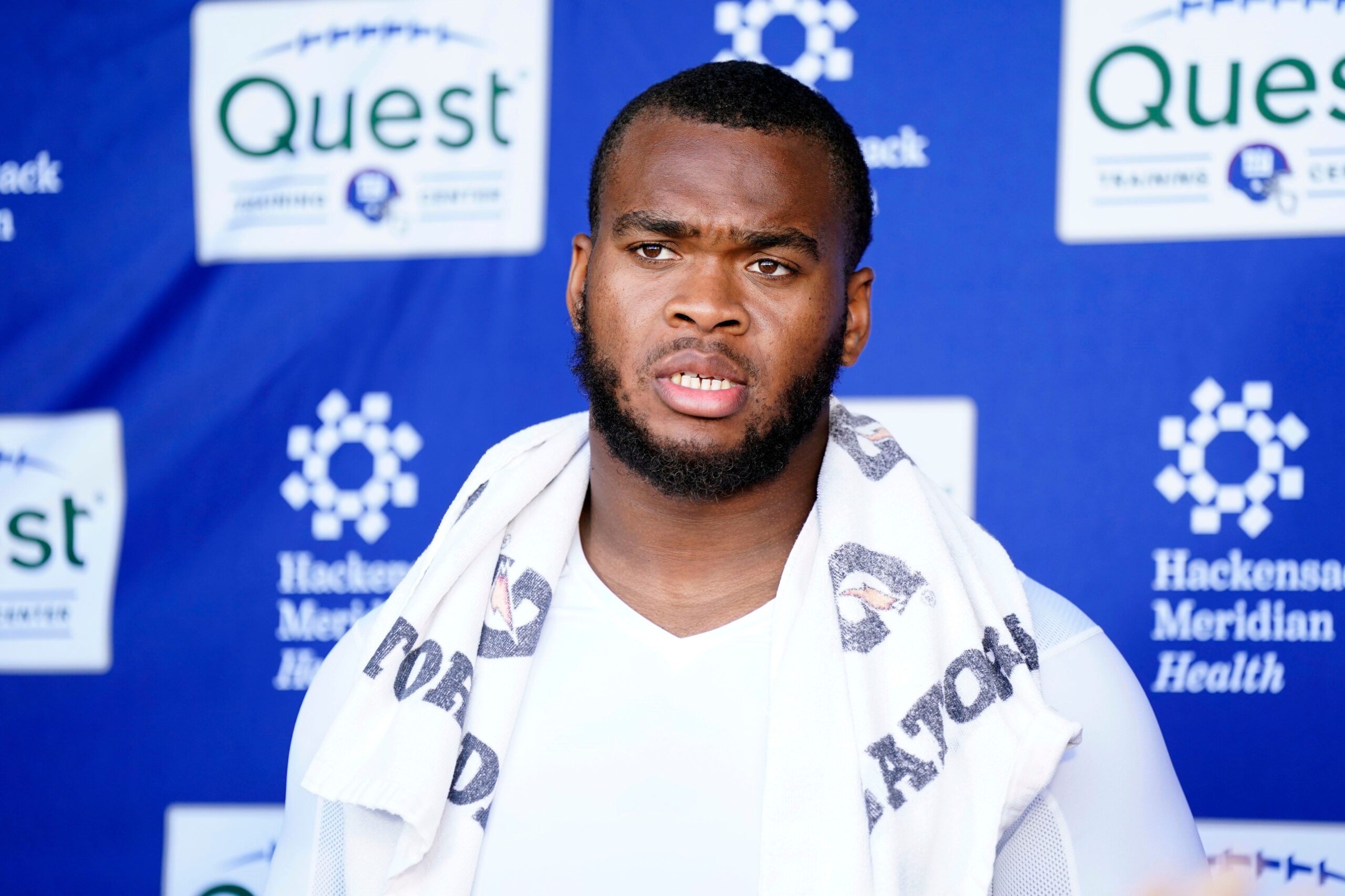 New York Giants offensive tackle Evan Neal talks to reporters after the organized team activities (OTA's) at the Giants training center on Wednesday, May 31, 2023, in East Rutherford.