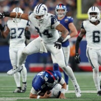 Sep 26, 2024; East Rutherford, New Jersey, USA; Dallas Cowboys defensive end Marshawn Kneeland (94) reacts after sacking New York Giants quarterback Daniel Jones (8) during the third quarter at MetLife Stadium.