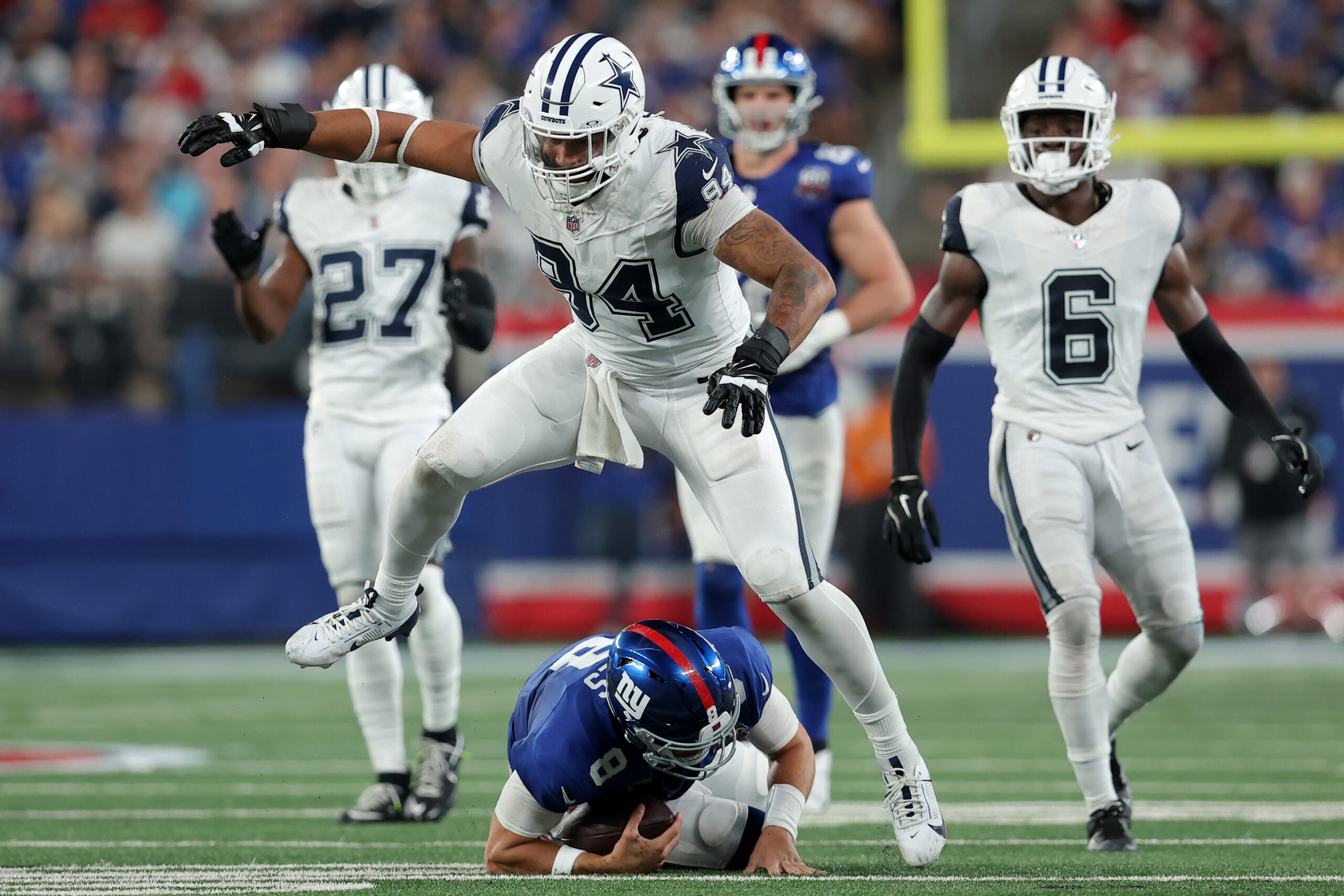 Sep 26, 2024; East Rutherford, New Jersey, USA; Dallas Cowboys defensive end Marshawn Kneeland (94) reacts after sacking New York Giants quarterback Daniel Jones (8) during the third quarter at MetLife Stadium.